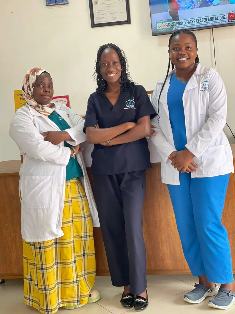 Alta Dental Clinic team members standing together inside the clinic